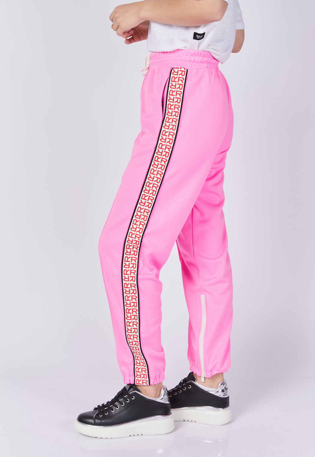 מכנסי טרנינג לנשים בצבע ורוד עם פס צד