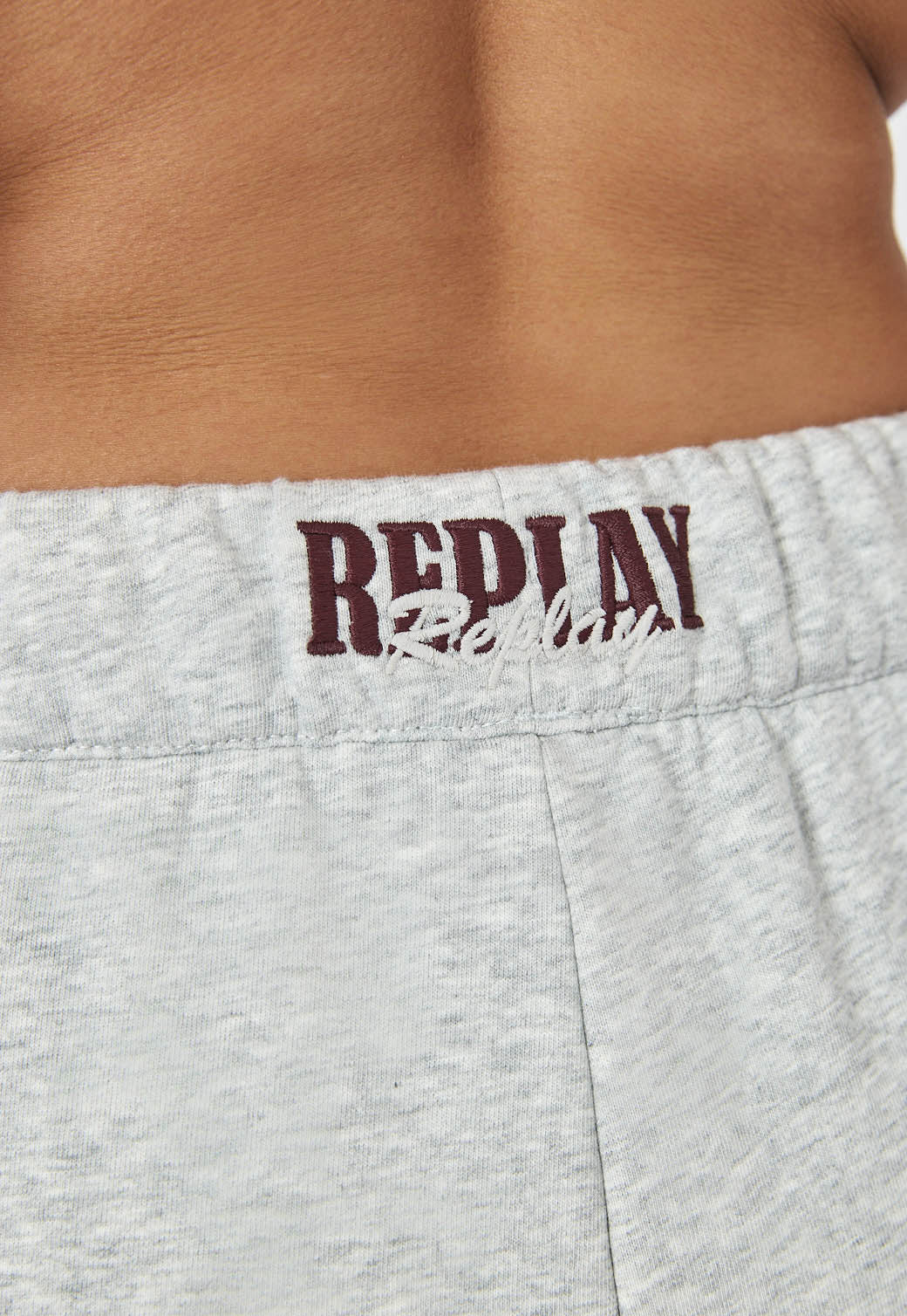 מכנסי טרנינג לנשים בצבע אפור מלנג’ עם שרוך מותן