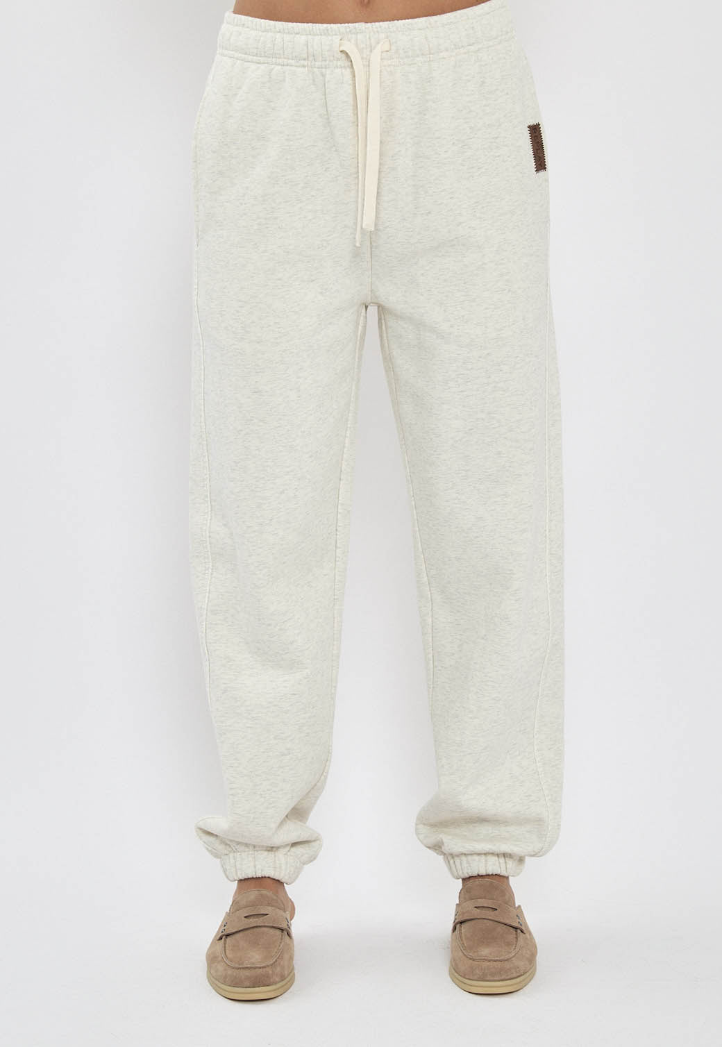 מכנסי טרנינג לנשים בצבע קרם עם שרוך